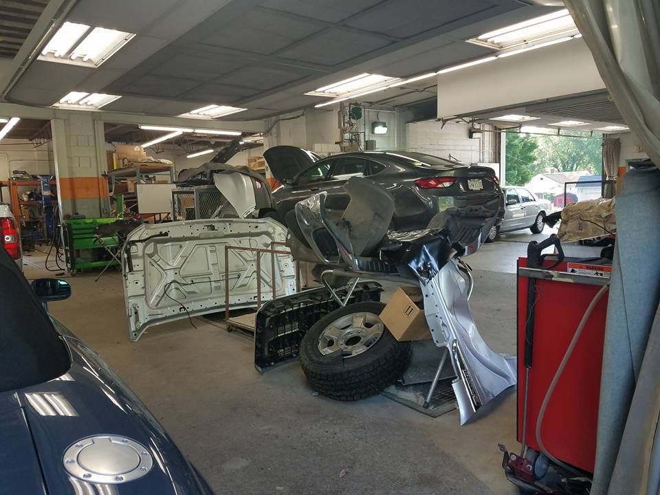 Wrecked Car in the Garage — Canton, OH — Aman's Collision Center Inc