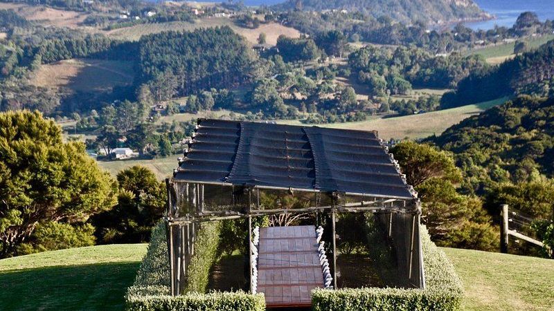 Batch Winery greenhouse sitting on top of a hill with a view of a valley.