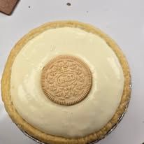 Oreo pie, creamy yellow filling with a single Oreo cookie in the center.