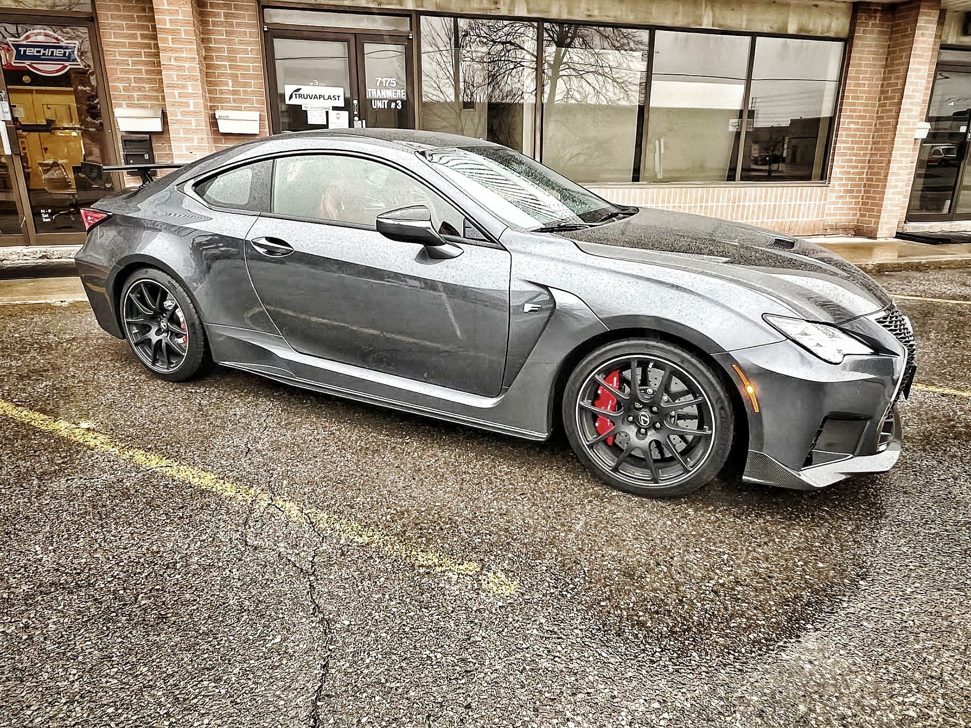Gray Lexus RC F coupe parked outside with red brake calipers. | Mecano Autoworks