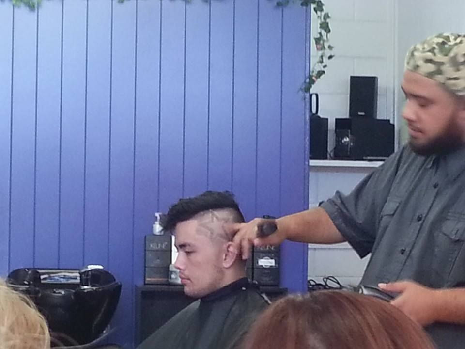 Barber Cutting a Client's Hair in A Barbershop — EDISON Hair Collective In Mackay, QLD