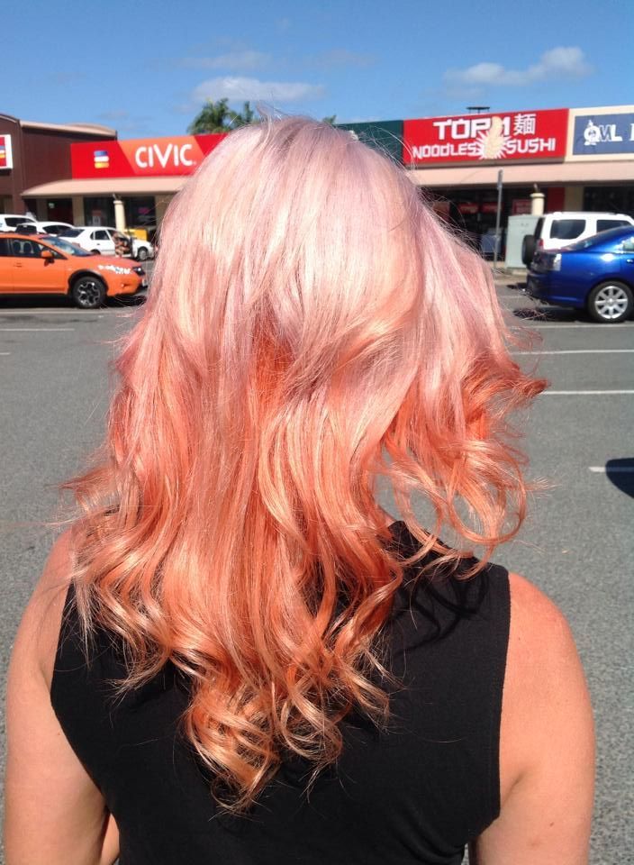 Woman with Wavy Hair, Pink to Orange Ombre, Standing in Front of A Shopping Center — EDISON Hair Collective In Mackay, QLD