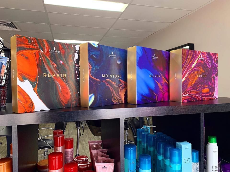 Four Colourful Hair Product Boxes on A Shelf — EDISON Hair Collective In Mackay, QLD