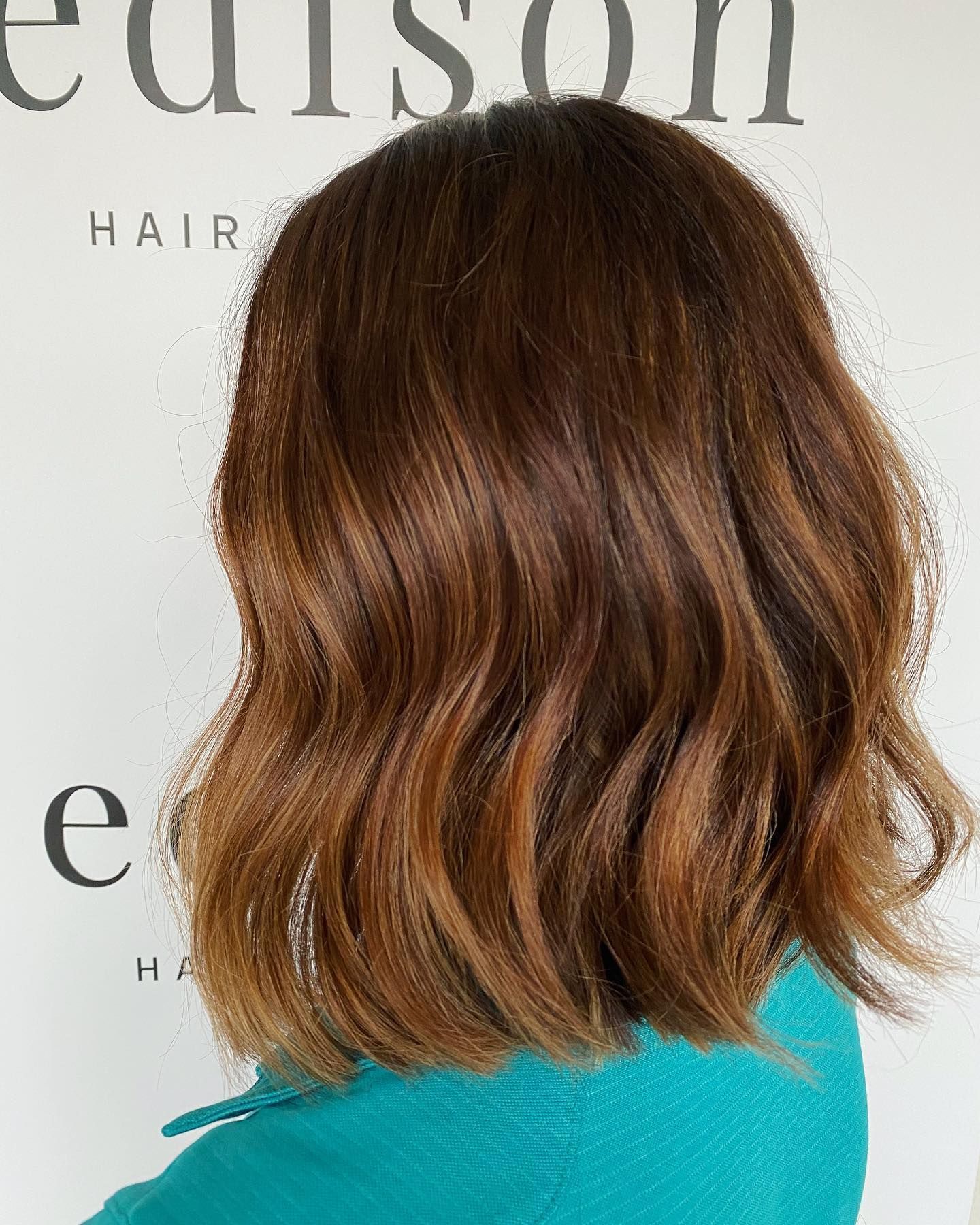 Woman with Wavy Brown Hair, Ombre Style, Against a White Background — EDISON Hair Collective In Mackay, QLD