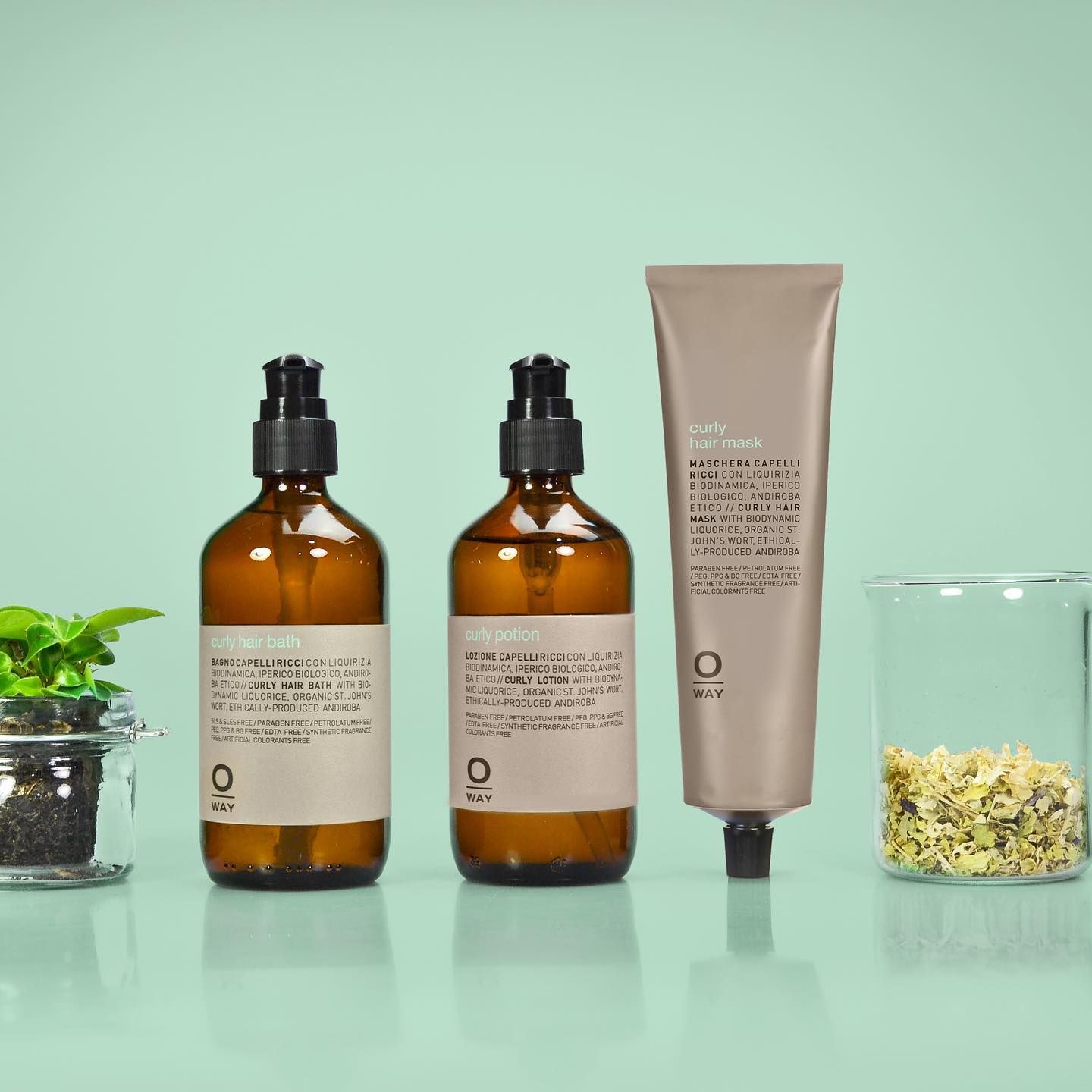 Bottles of Brown Liquid With Pump Tops, a Tube of Skincare — EDISON Hair Collective In Mackay, QLD