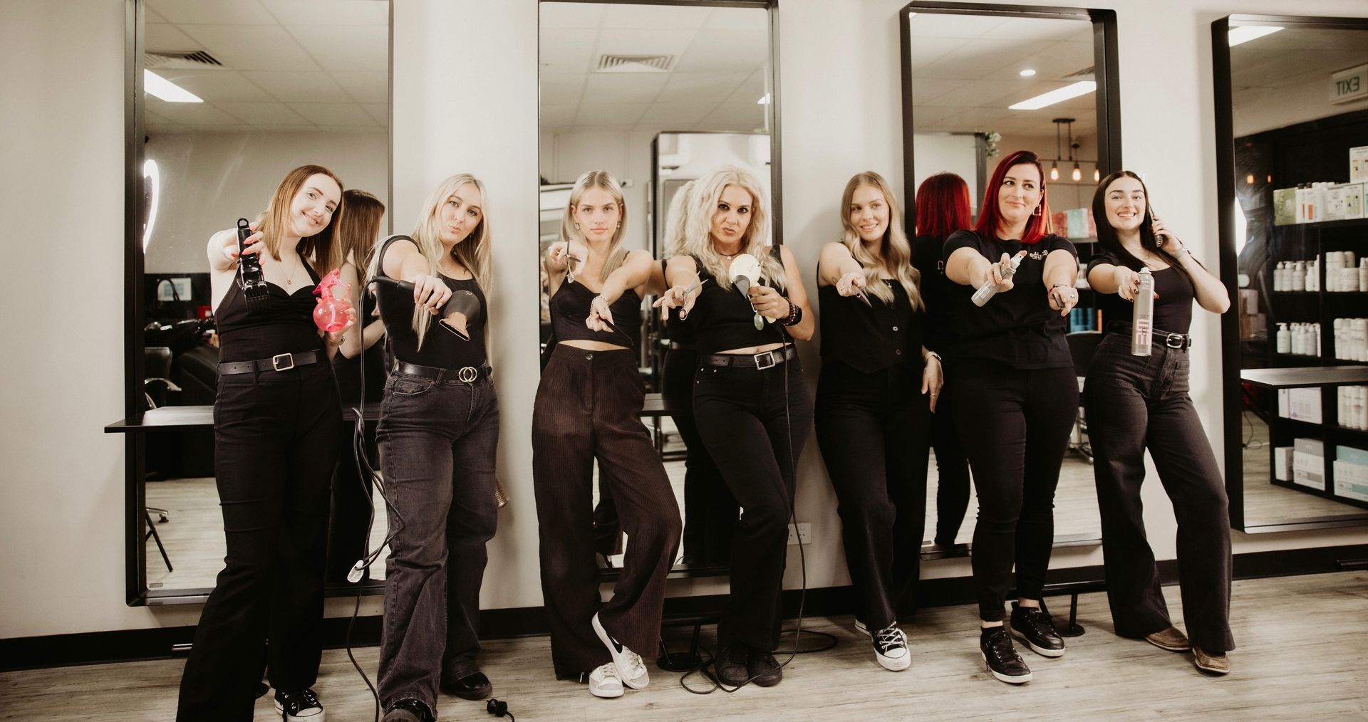 Five Stylists in Black T-shirts Pose in a Salon — EDISON Hair Collective In Mackay, QLD