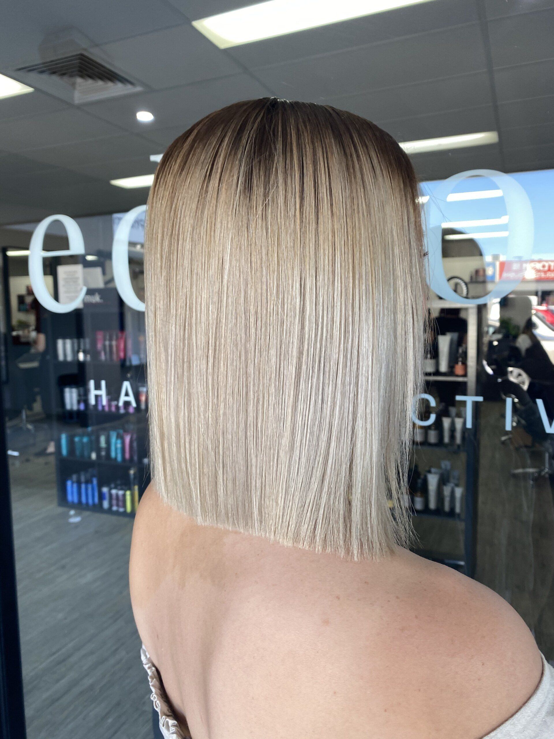 Blonde Hair with A Dark Root, Cut Into a Blunt Bob, Outside of A Salon — EDISON Hair Collective In Mackay, QLD