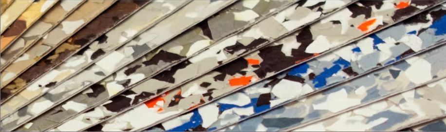 A close up of a stack of fabrics with a camouflage pattern.