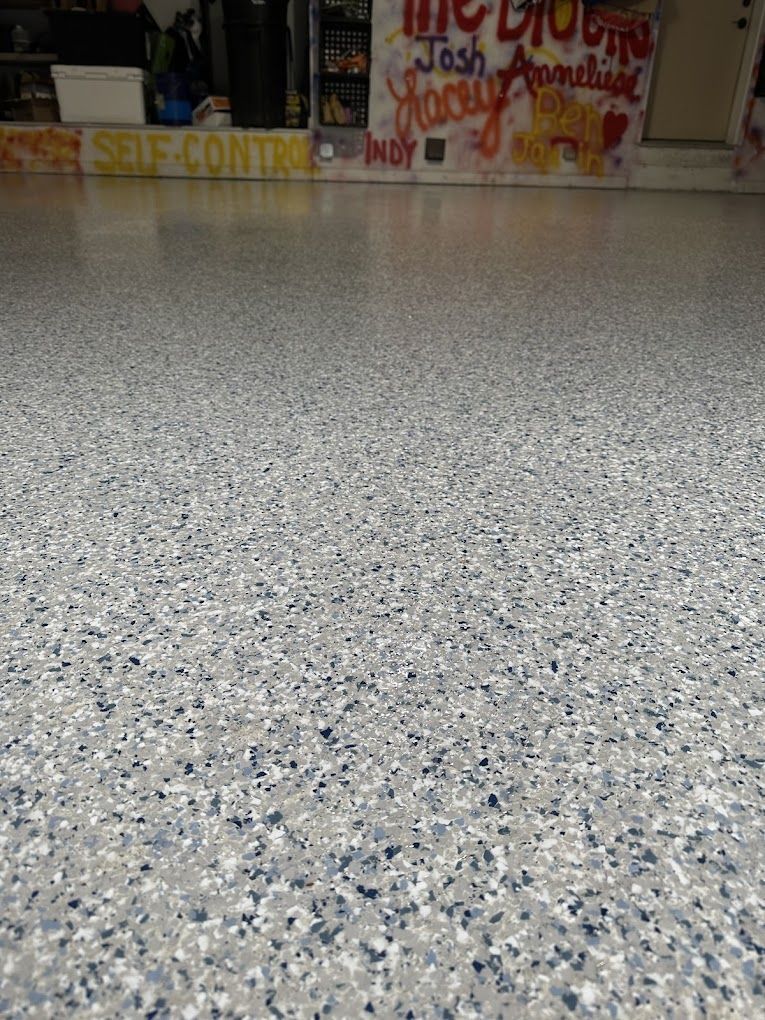 A close up of a garage floor with a sign on it.