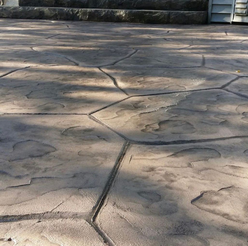 A close up of a concrete floor with a geometric pattern