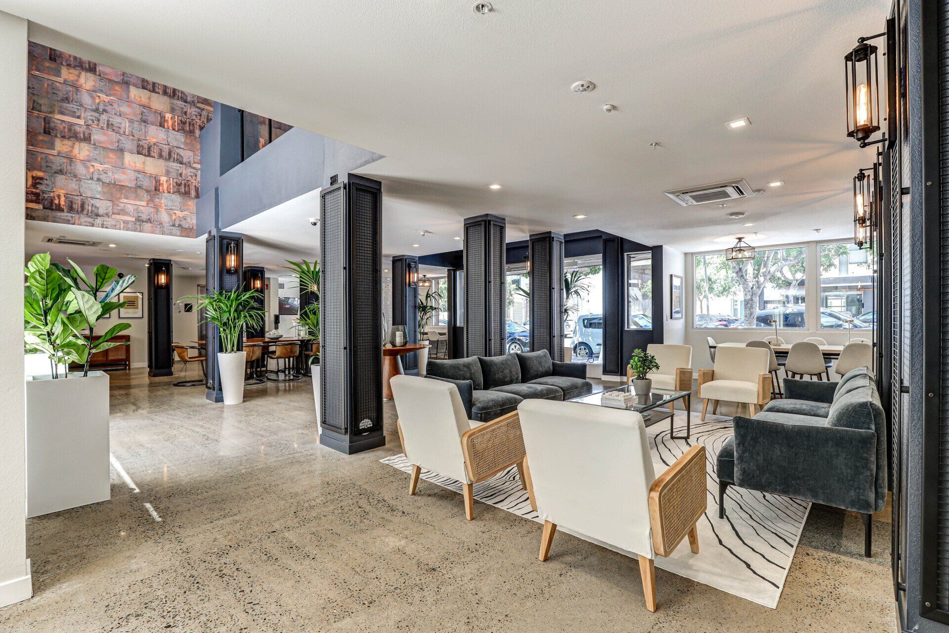 Aerial drone view of apartment complex and neighboring area