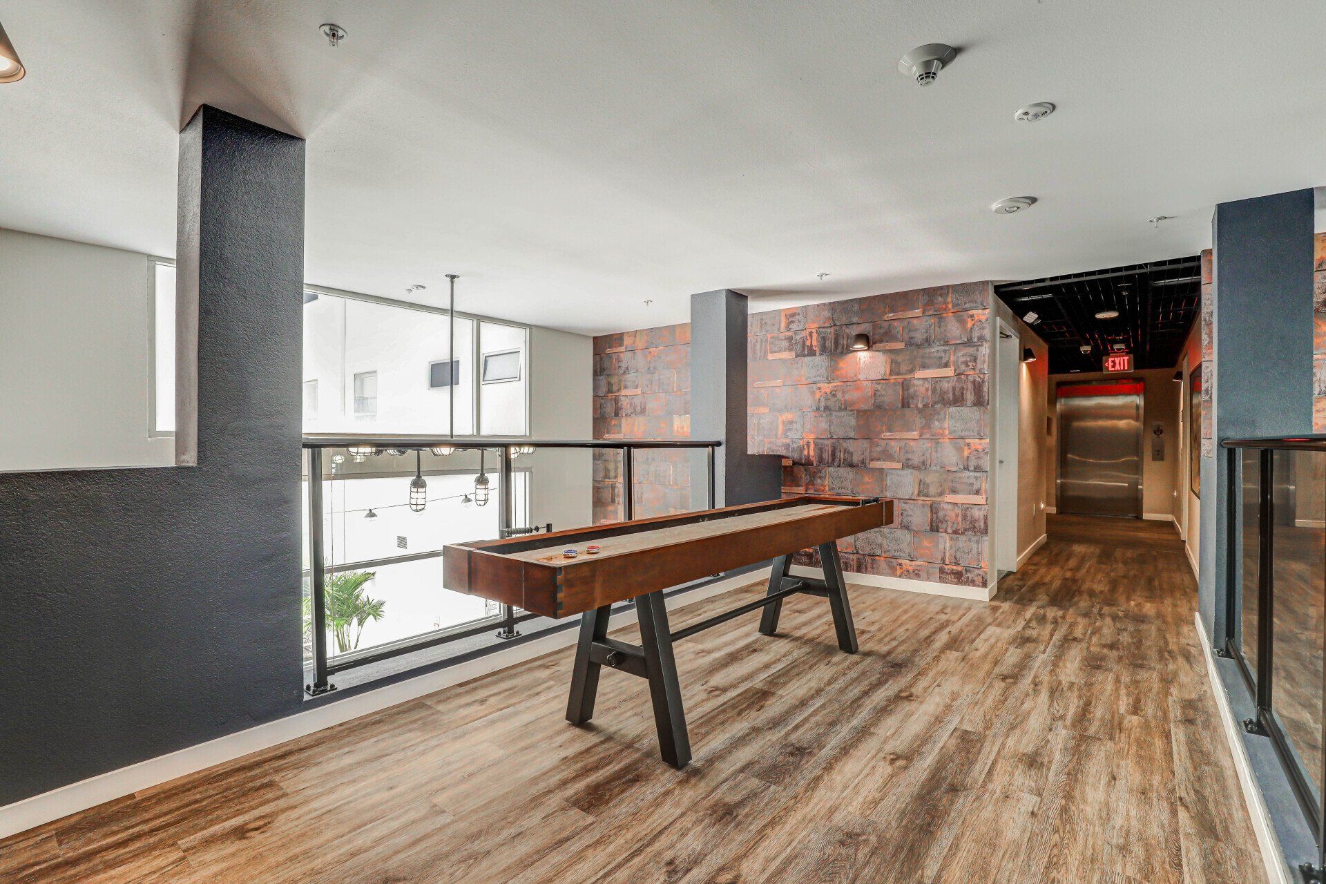 Aerial drone view of apartment complex and neighboring area