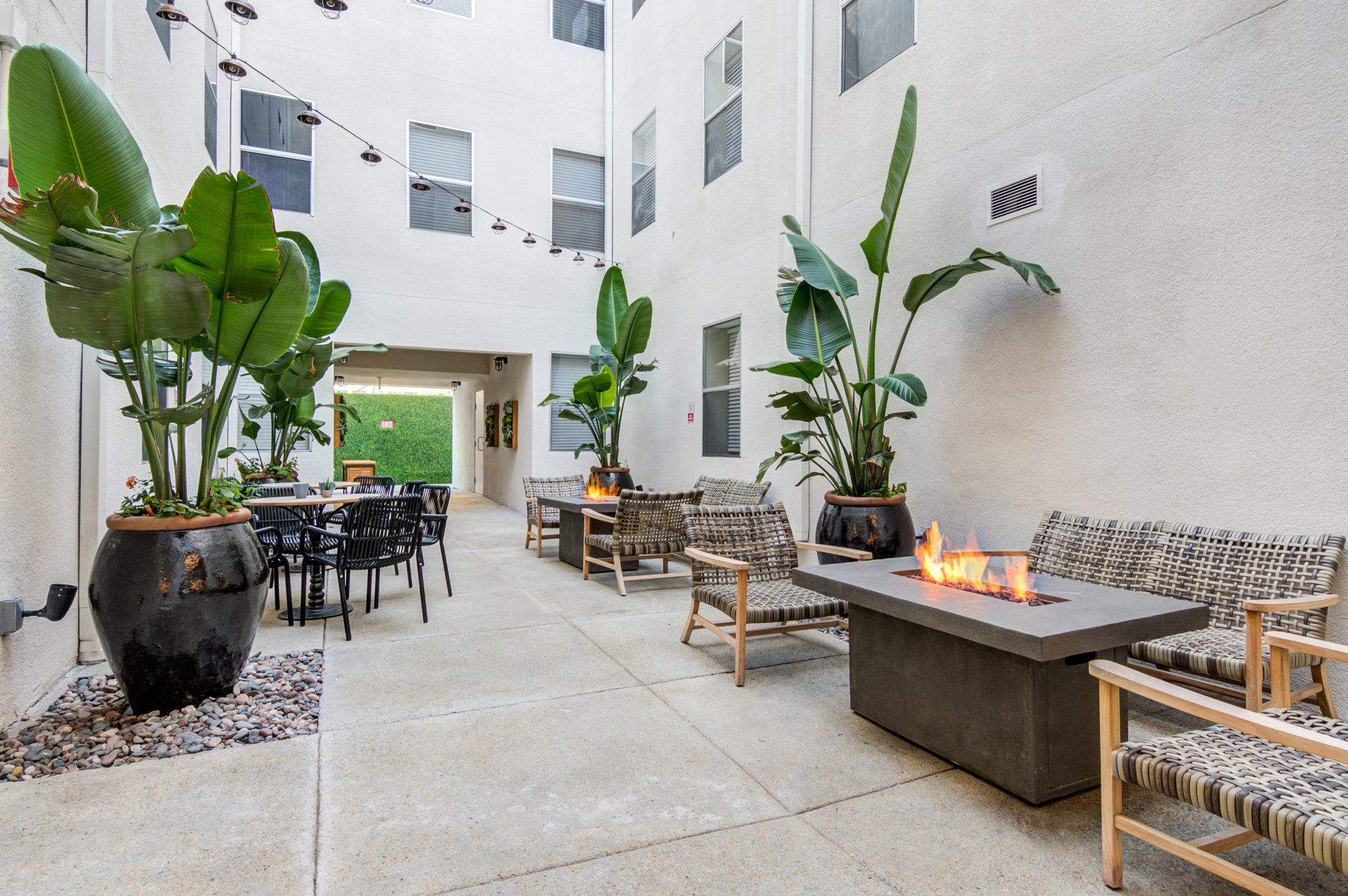 Exterior of community area with fireplaces and luxurious chairs