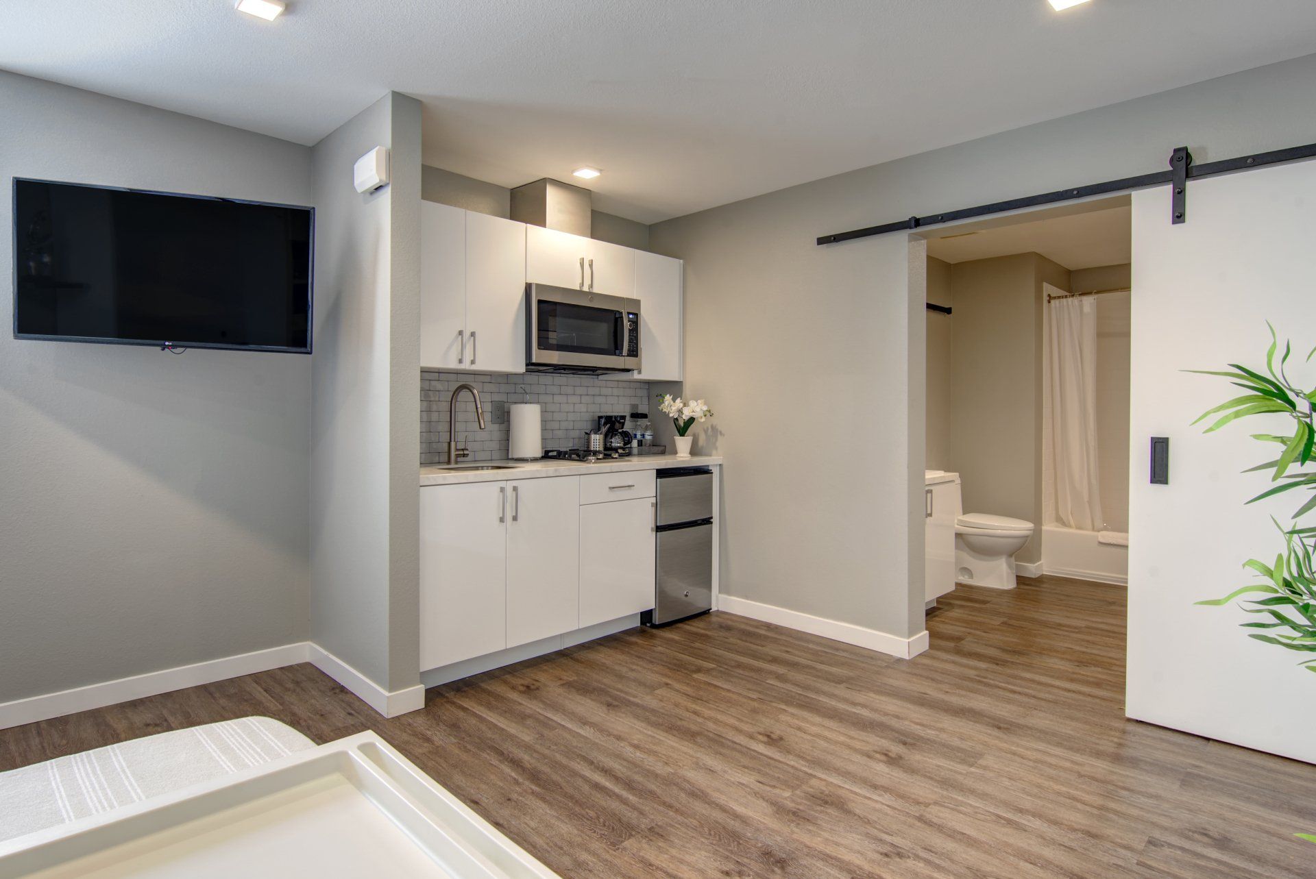 Interior of kitchen with view into bathroom