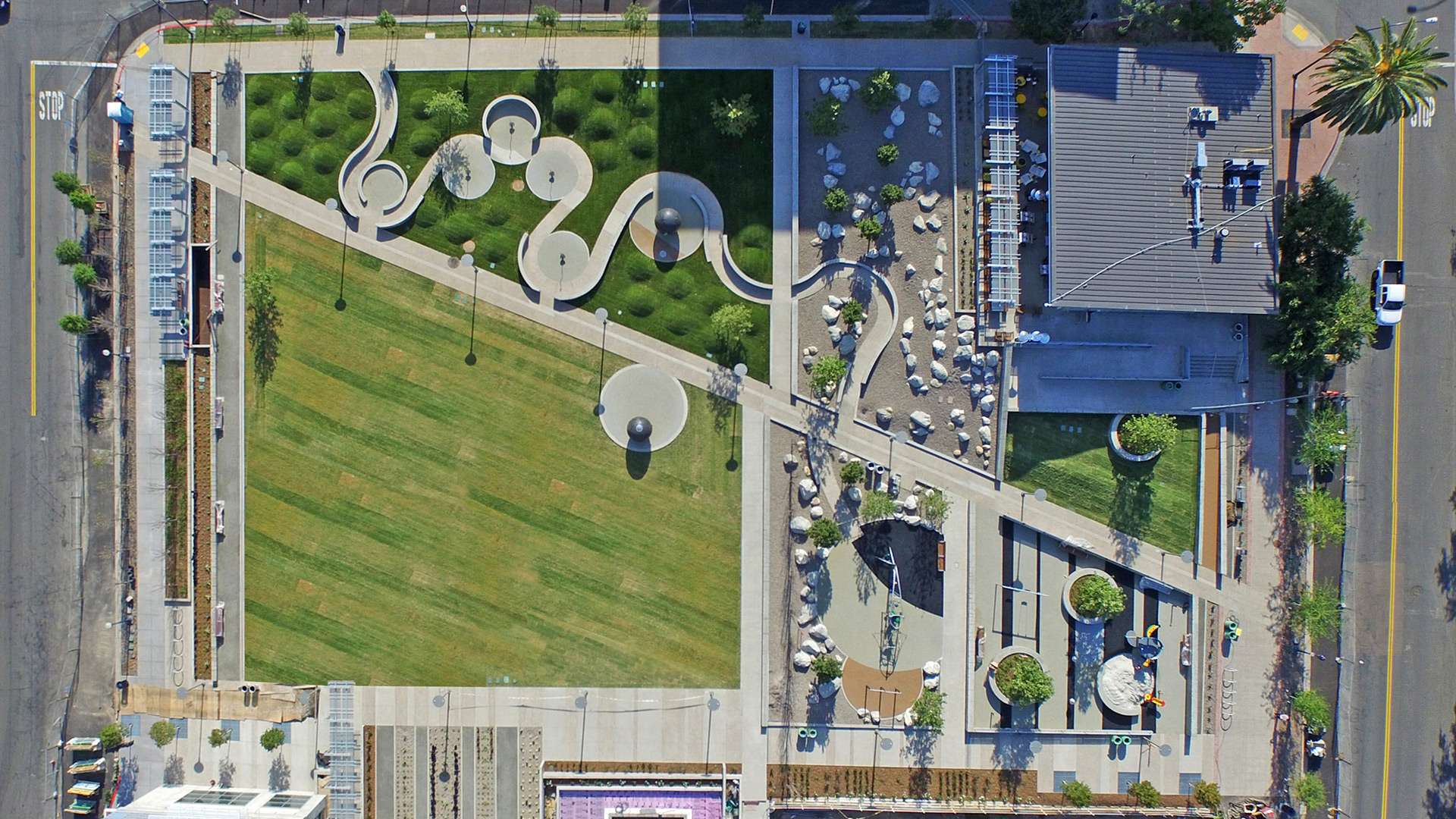 Aerial drone view of apartment complex and neighboring area