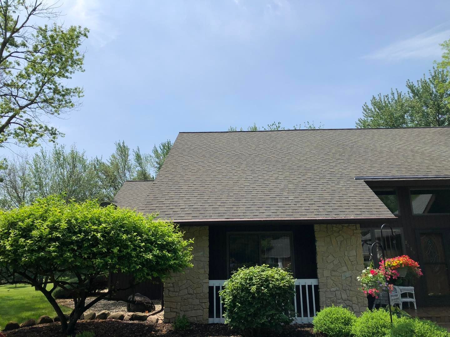 A house with a roof that has a lot of shingles on it.