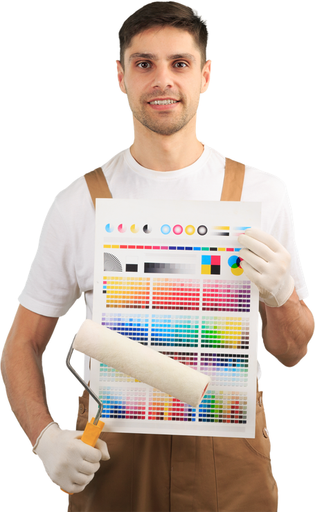 A man is holding a paint roller and a palette of colors.