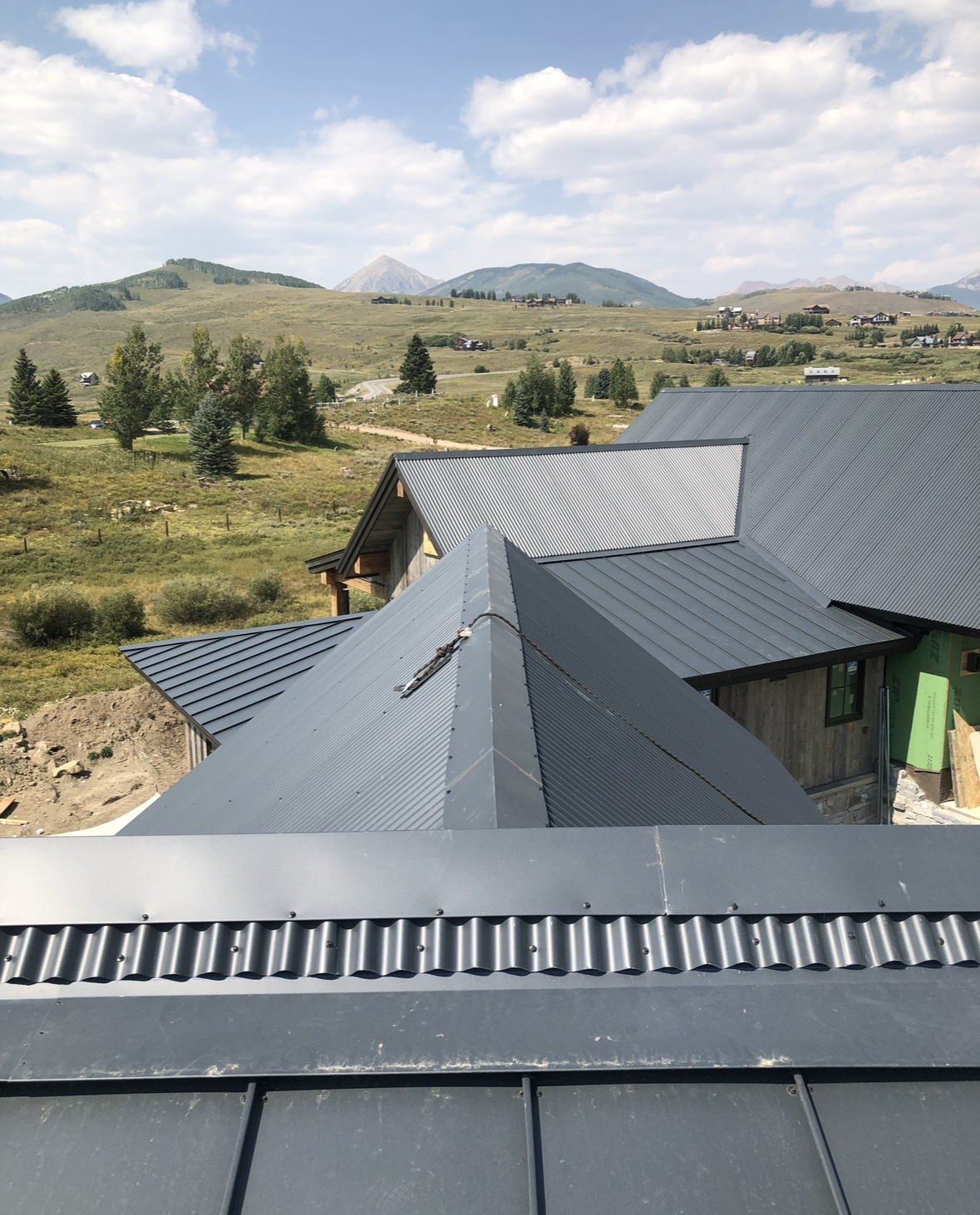 A house with a roof that has a drain on it