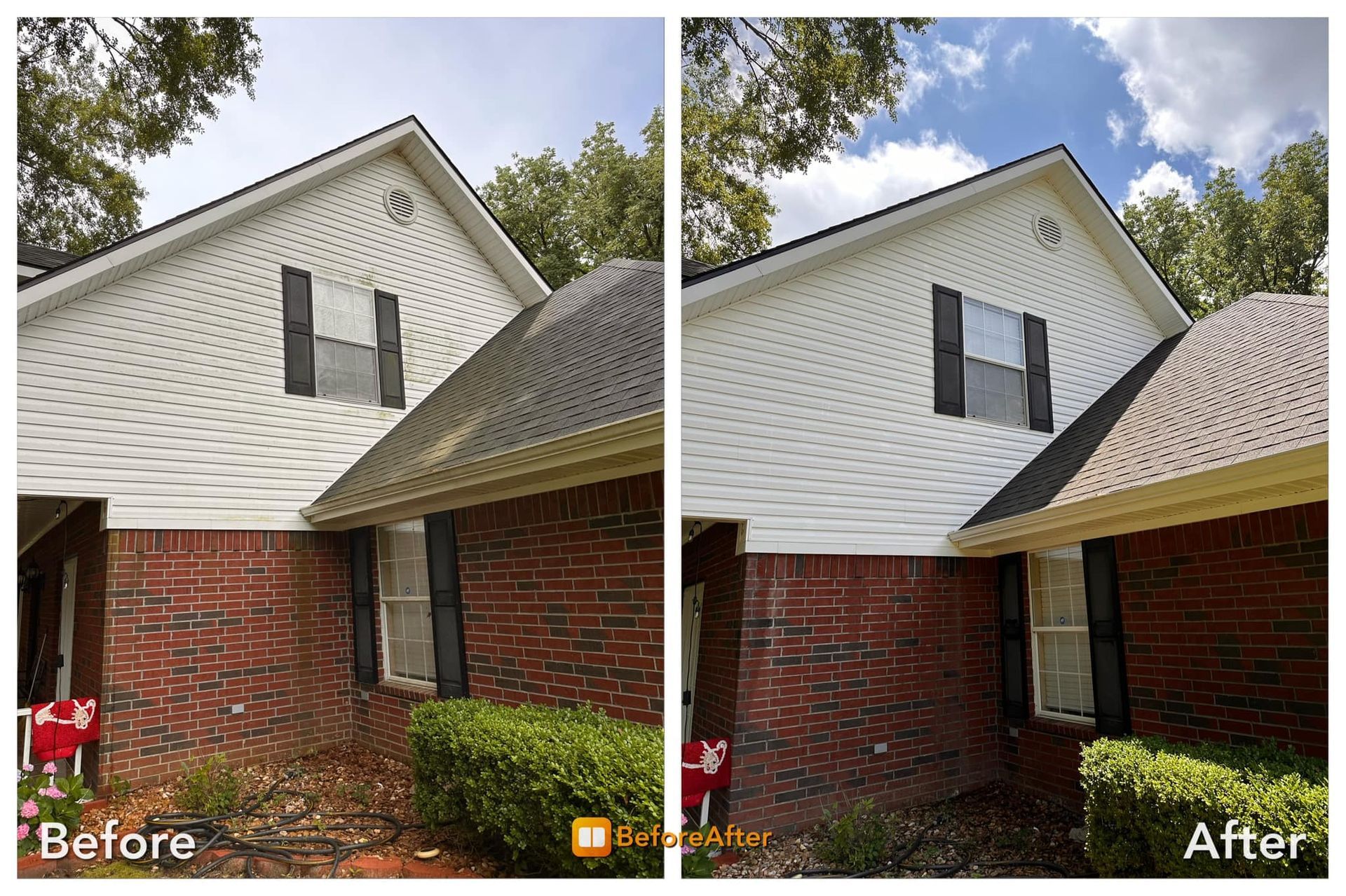 Side-by-side view of a house, showing dirty vs. clean siding. White siding, red brick, black shutters; blue sky.