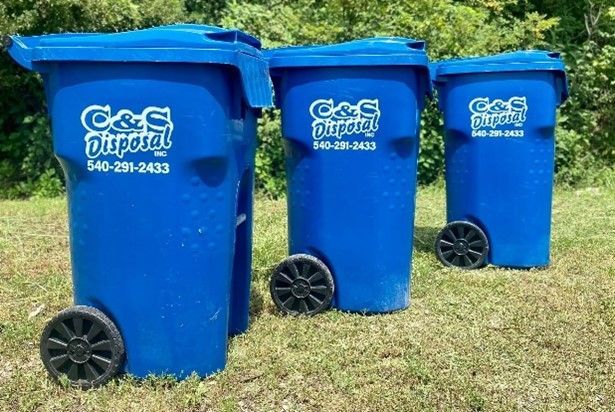 Garbage and recycling bins awaiting pickup. Garbage and recycling bins awaiting pickup.