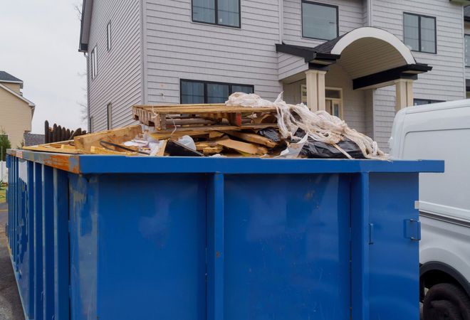 Blue Garbage Dumpster Full of Waste — Station, VA — C & S Disposal