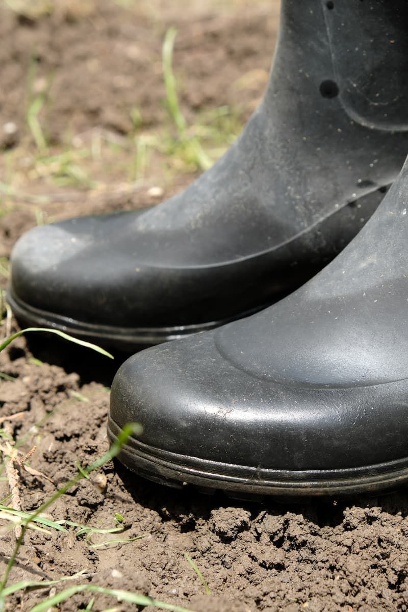 Close Up Photo of Rain Boots — Farming Equipment & Livestock Troughs in Crows Nest, QLD