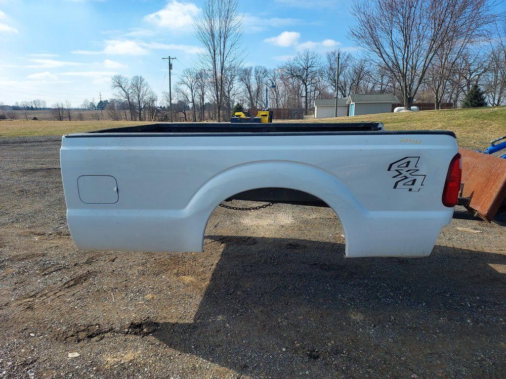 A white truck bed with the word ram on it