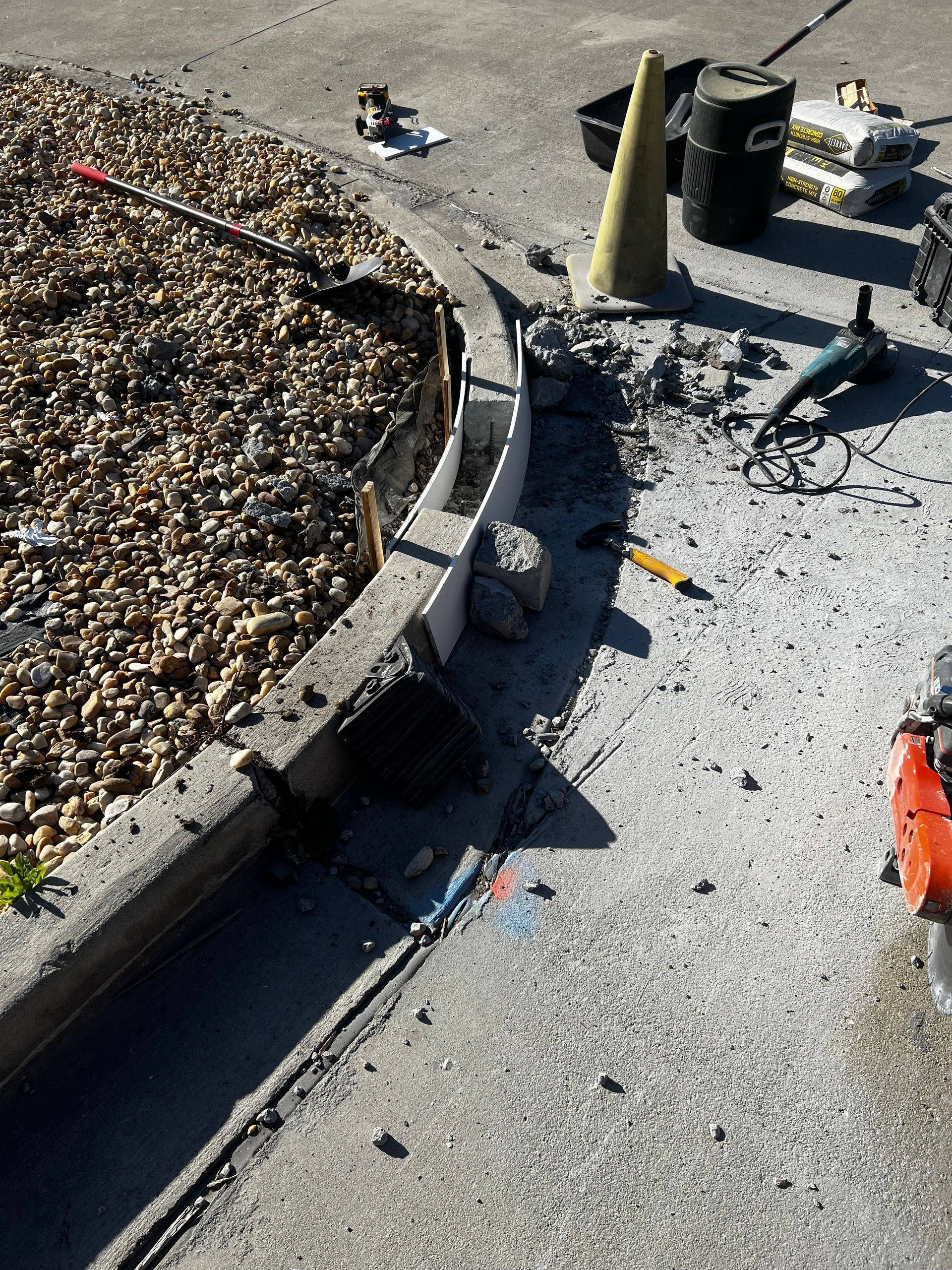 An aerial view of a construction site with tools and cones