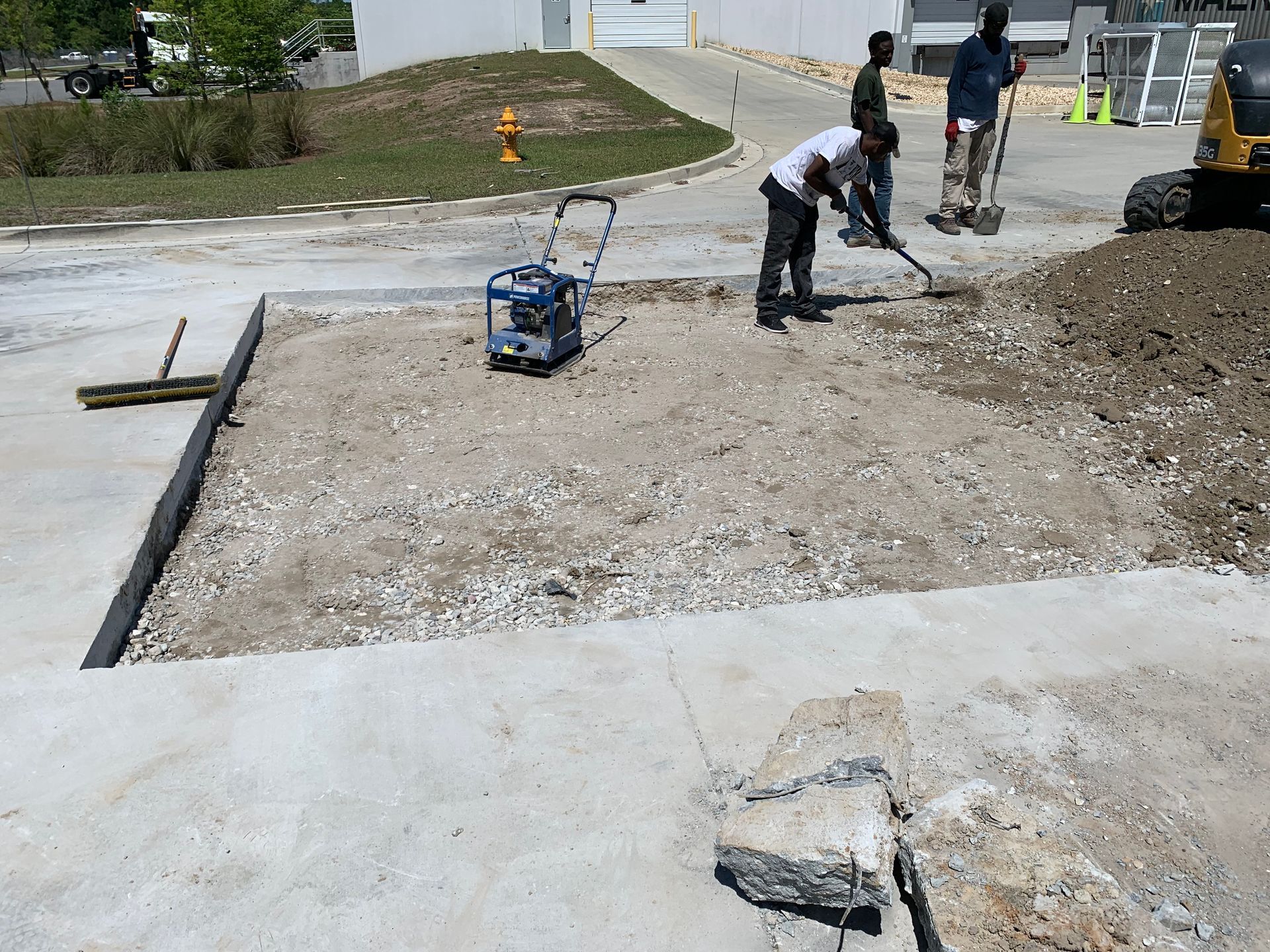 A man is using a shovel to dig a hole in the ground