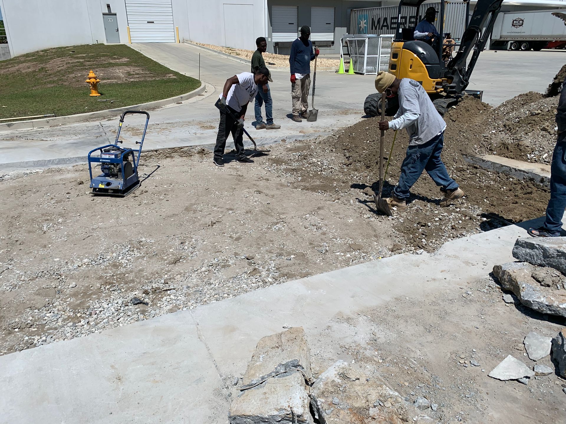 A group of construction workers are working on a construction site