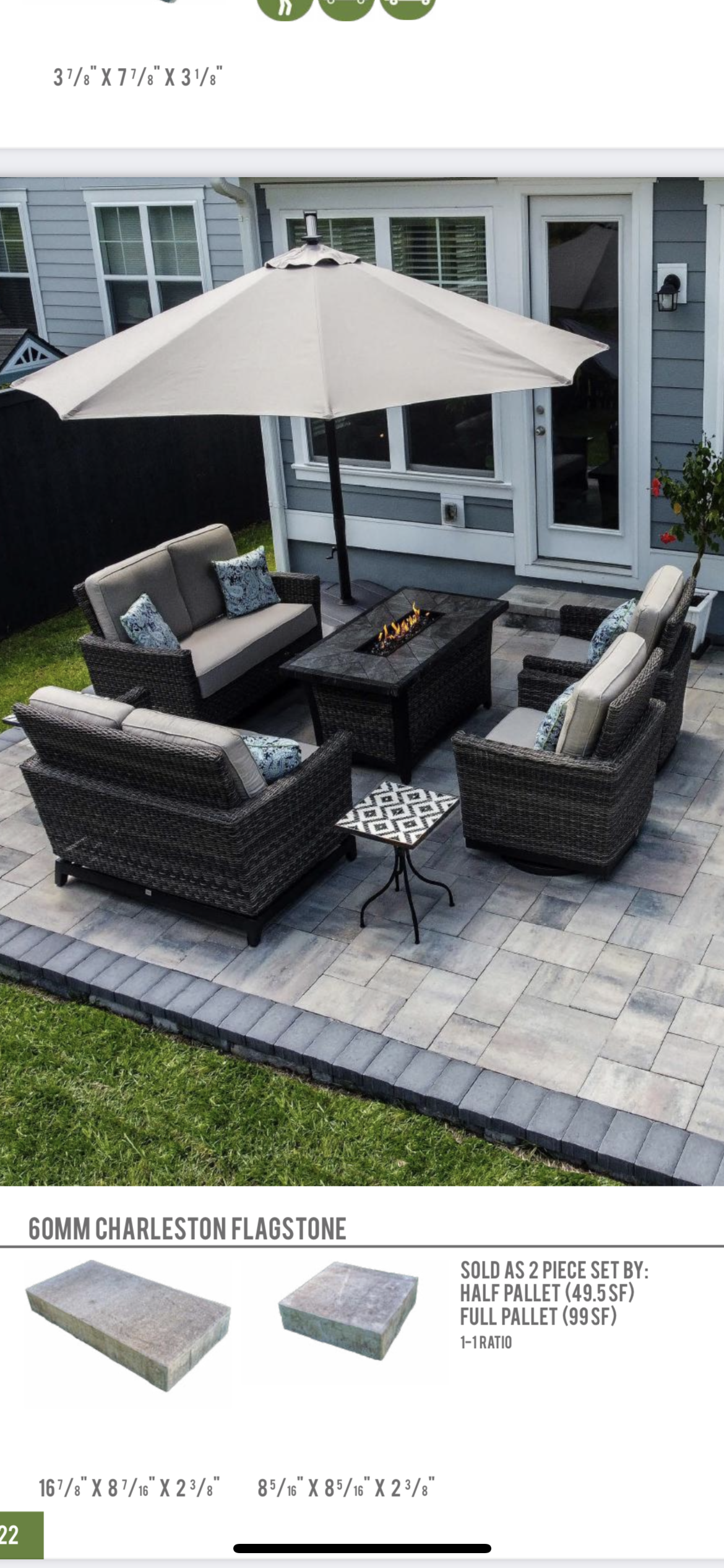 A patio with a couch , chairs , table and umbrella.