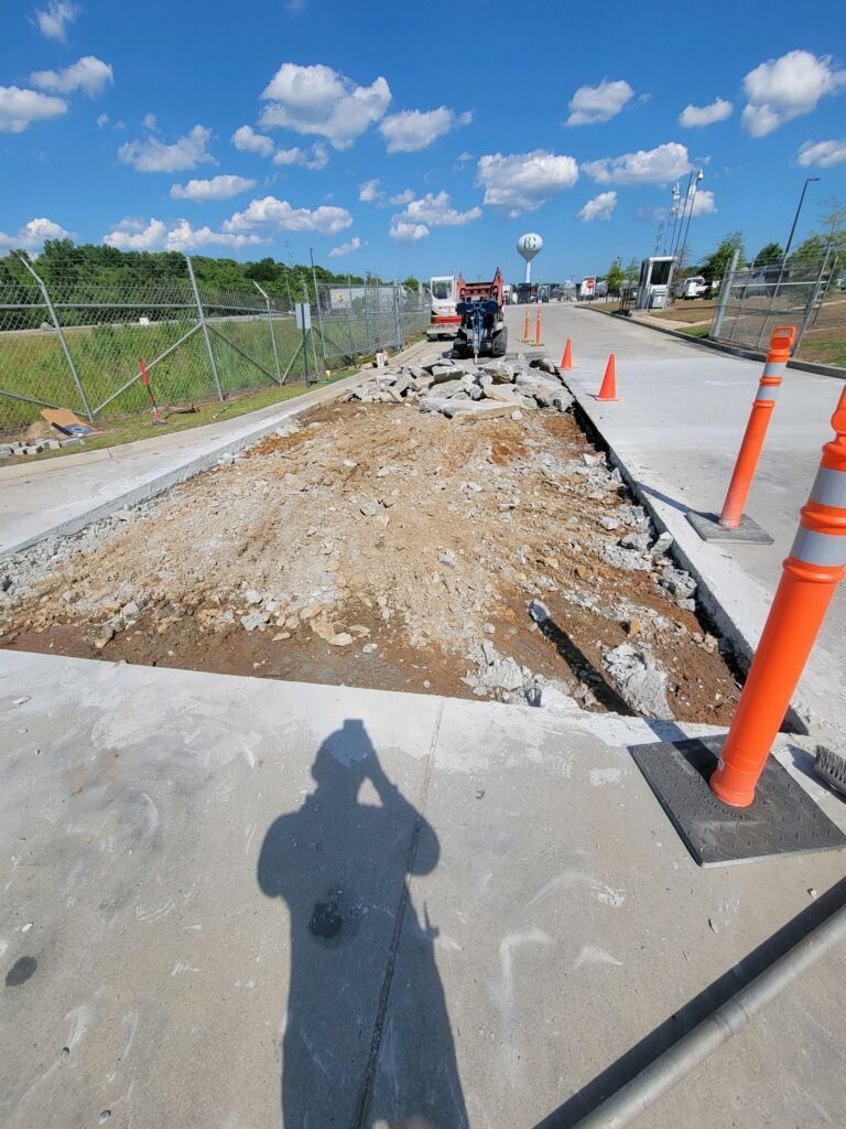 A shadow of a person taking a picture of a construction site