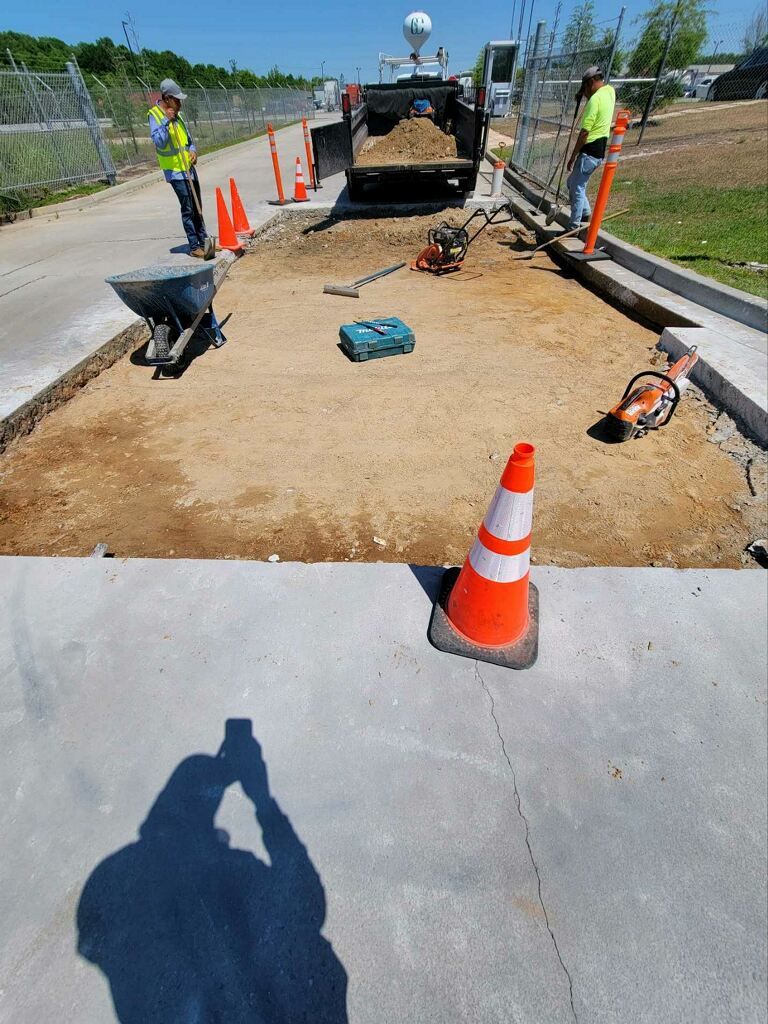 A man is taking a picture of a construction site.
