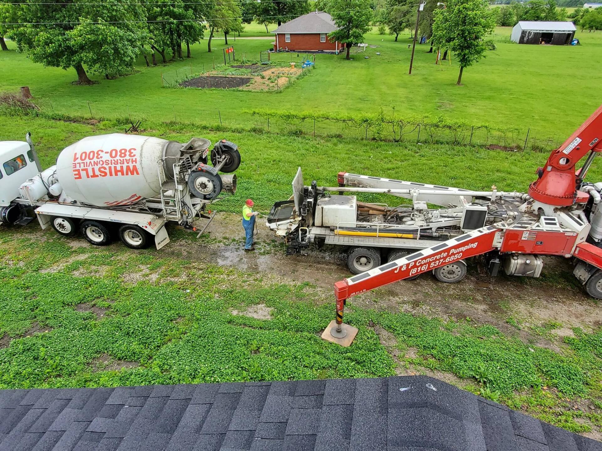 A truck completing a ready-mixed concrete delivery to a property in Lee's Summit, MO