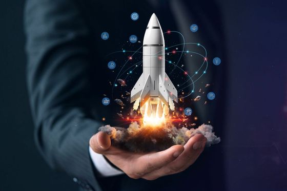 Businessperson holding a rocket, symbolizing increased revenue through AI-powered pricing