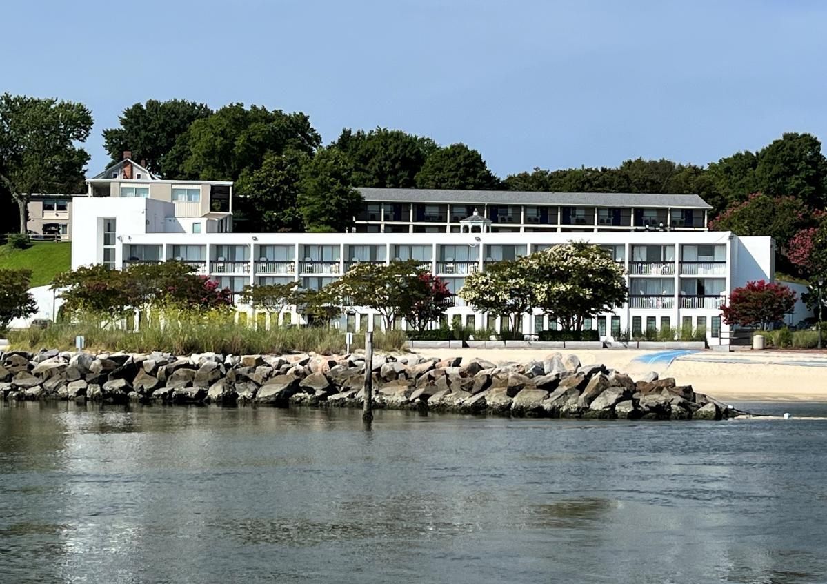 Exterior view of Yorktown Beach Hotel from across the water