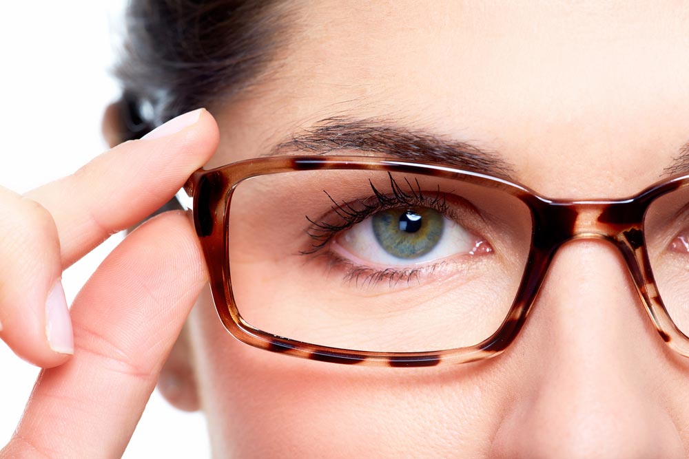 Woman wearing eyeglasses — Optometrist in Banora Point, NSW