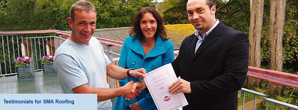 Two men shaking hands with a certificate with a lady smiling