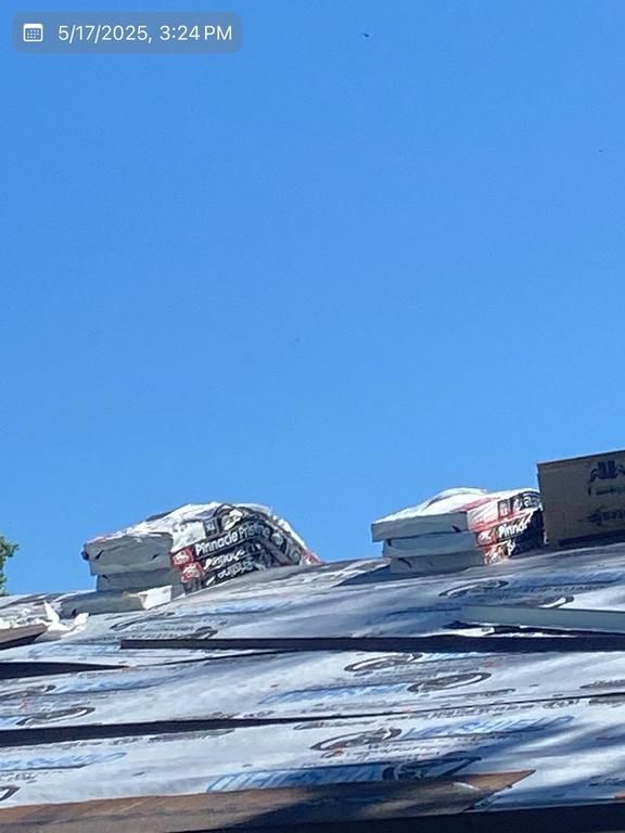 A picture of a roof with a blue sky in the background.