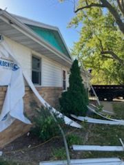 A house that has been damaged by a tornado.