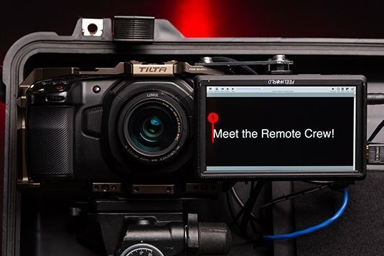 A black camera mounted inside a case with a screen displaying 