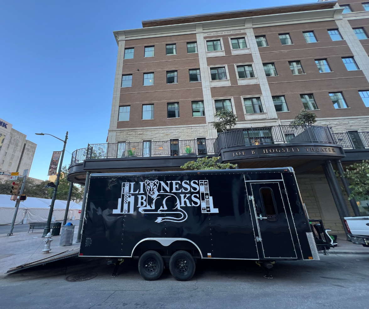 Lioness Books used book mobile in front of a building