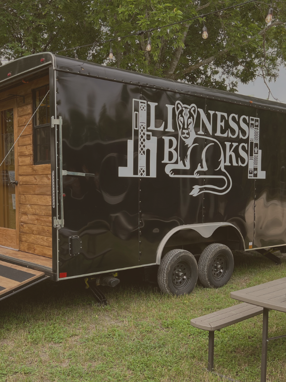 A black trailer with the words lioness books on it