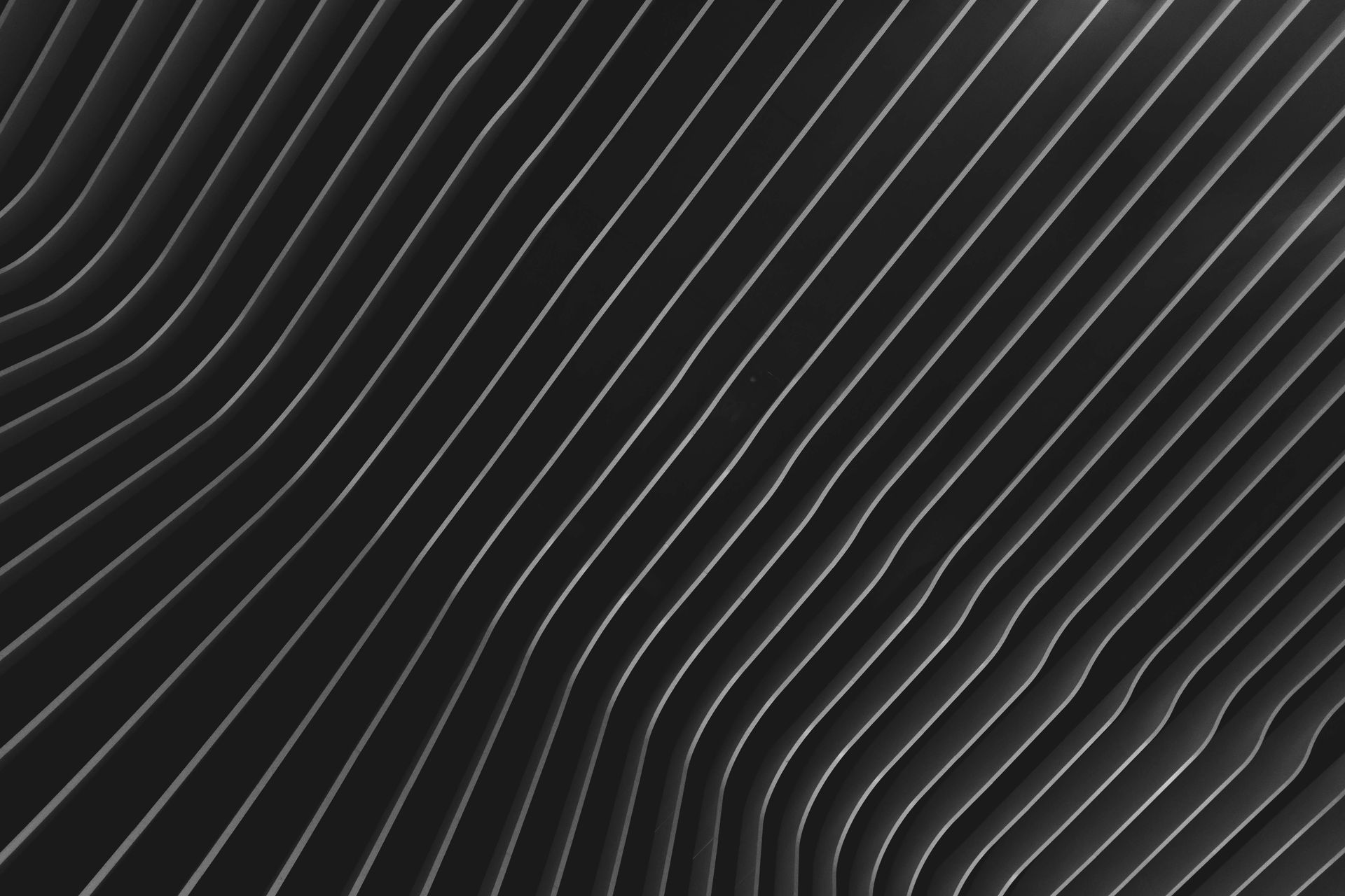A close up of a black and white photo of a striped pattern.