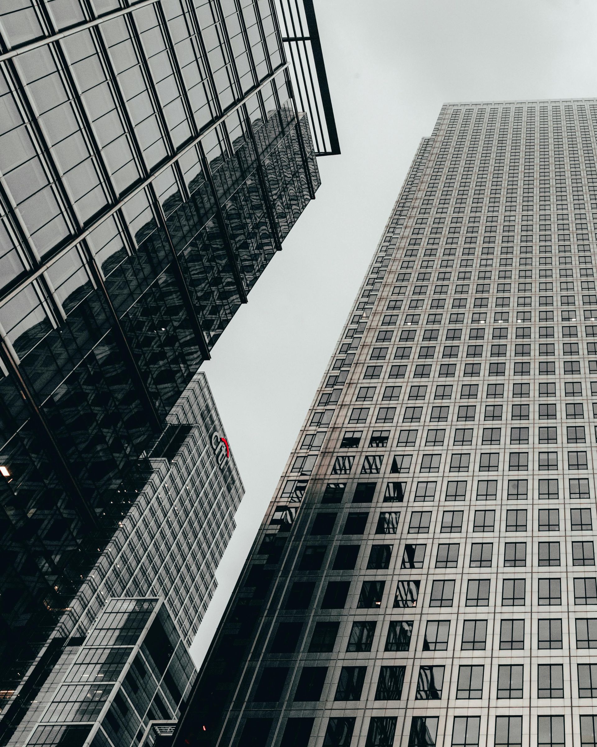 Looking up at a row of tall buildings