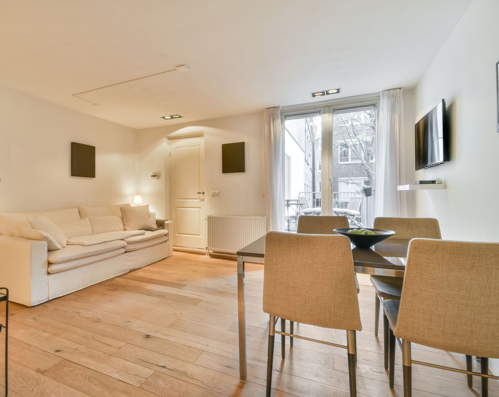 A living room with a table and chairs and a couch