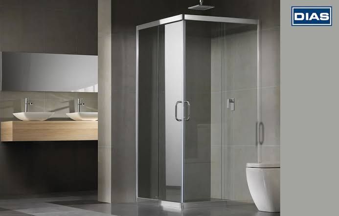 A bathroom with a shower stall and a diab logo on the wall