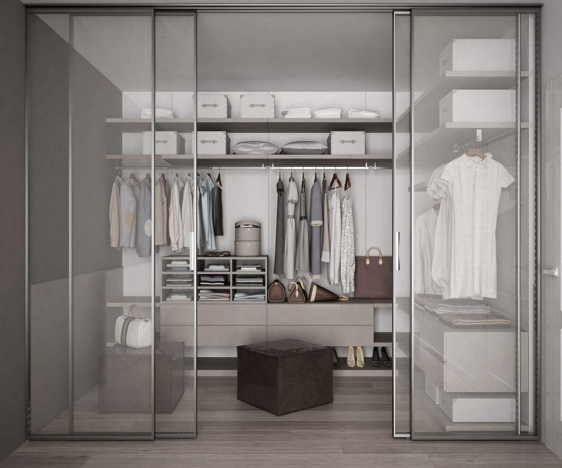 A walk in closet with sliding glass doors filled with clothes.