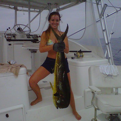 Woman Holding a Fish — Dania FL — Ironclad Welding