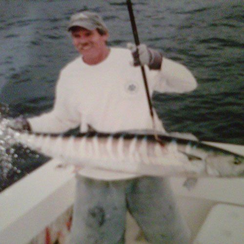 Man Holding a White Fish — Dania FL — Ironclad Welding